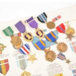 Medals - Nine United States of America Decorations and Awards, and a wall chart.