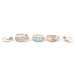 Three gemset dress rings and a pair of earrings.