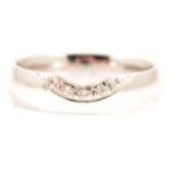 A diamond five stone ring.