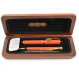 Parker - A Centennial Duofold Coral Fountain Pen and Pencil Set.