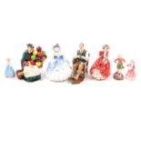 Seven Royal Doulton figures and a Royal Worcester figure,