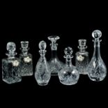 Seven cut glass decanters