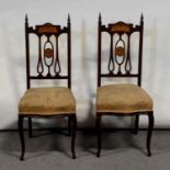 Pair of Art Nouveau inlaid chairs, mahogany frames, pierced backs, upholstered serpentine seats,