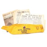 Box of World War Two newspapers and two Civil Defense Corps Welfare arm bands