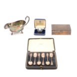 A cased set of silver teaspoons, cigarette box, matchbox holder etc.