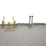 Brass ball and rail fender; and andirons; and two fire dogs.