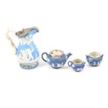 Wedgwood blue jasper ware three-piece teaset; and a blue ground Parian jug.