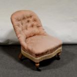 Edwardian walnut nursing chair, and another,