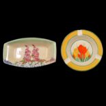 Clarice Cliff, a 'Crocus' circular ashtray and another Clarice Cliff pin dish