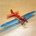 Red and blue gull wing aircraft, Redfin 061 diesel engine
