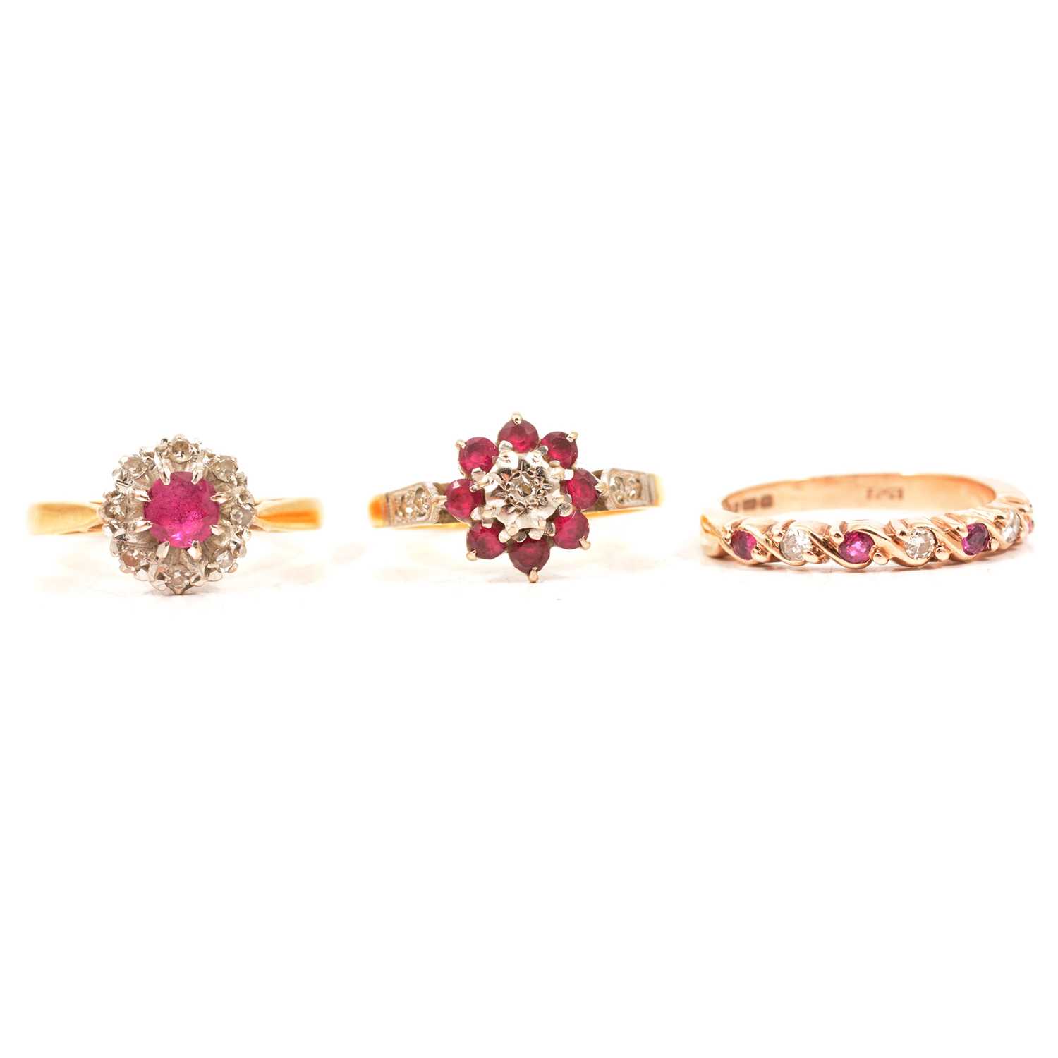 Three ruby and diamond rings.
