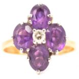 An amethyst and diamond dress ring.