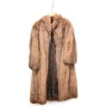 A Philip Hockley full length brown fur coat.