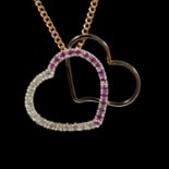 A pink stone and diamond heart shaped pendant and chain.