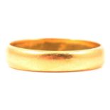 A 22 carat yellow gold wedding band.