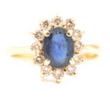 A sapphire and diamond cluster ring.