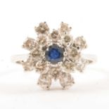 A sapphire and diamond cluster ring.