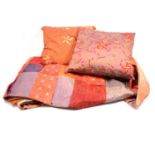 A Liberty silk throw and two cushions.