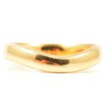 An 18 carat yellow gold wedding band.