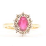 A ruby and diamond cluster ring.