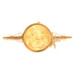 A Gold Full Sovereign Coin brooch.