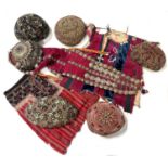 Collection of Turkmen hats and clothing