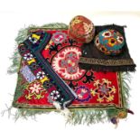Quantity of Uzbekistan textiles, hats, and a Bridal Viel