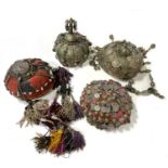 Four Afghan hats, metal adornments