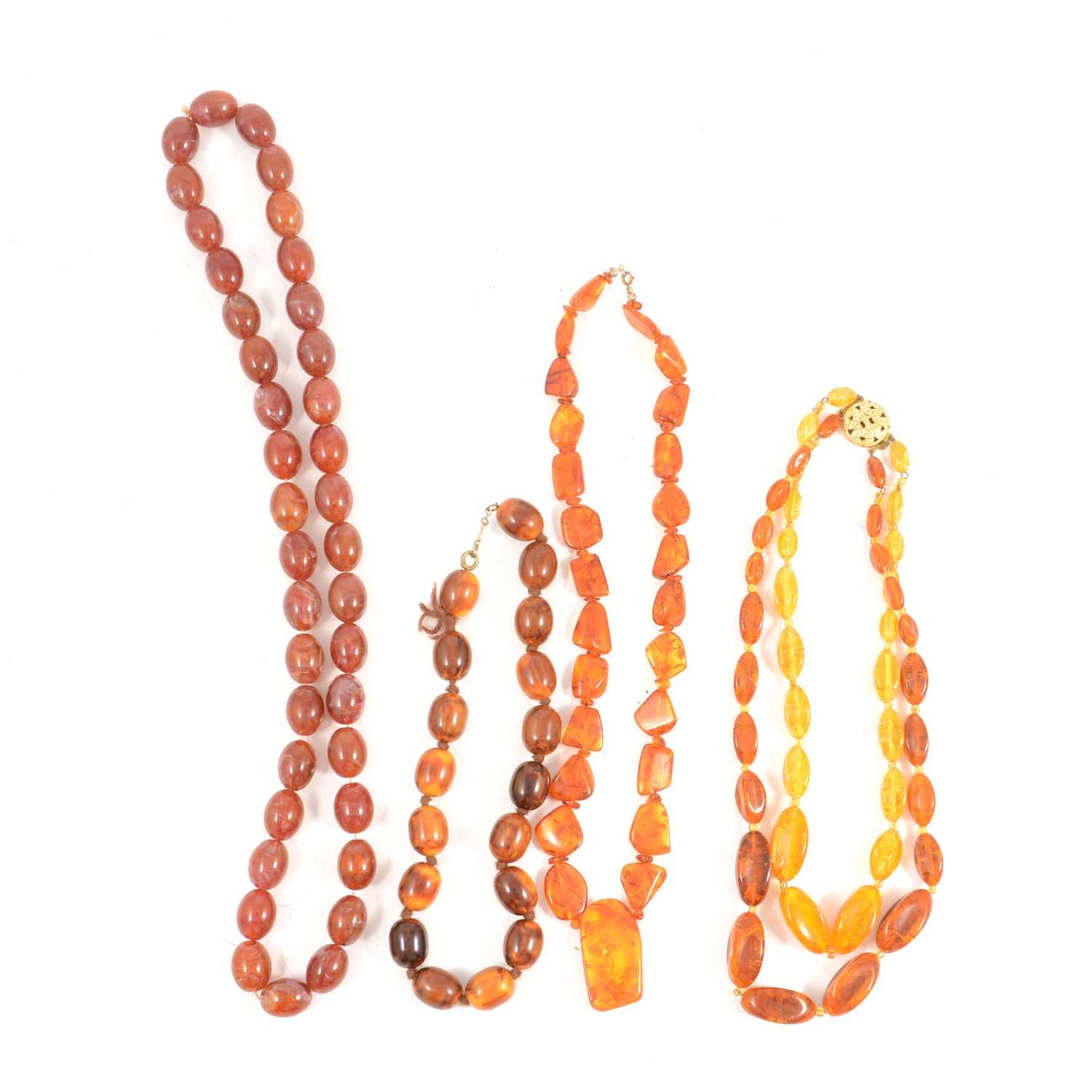 Four strings of "Amber" beads.