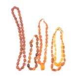 Four strings of "Amber" beads.