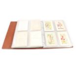 An album of silk embroidered cards,