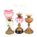 Collection of three brass oil lamps