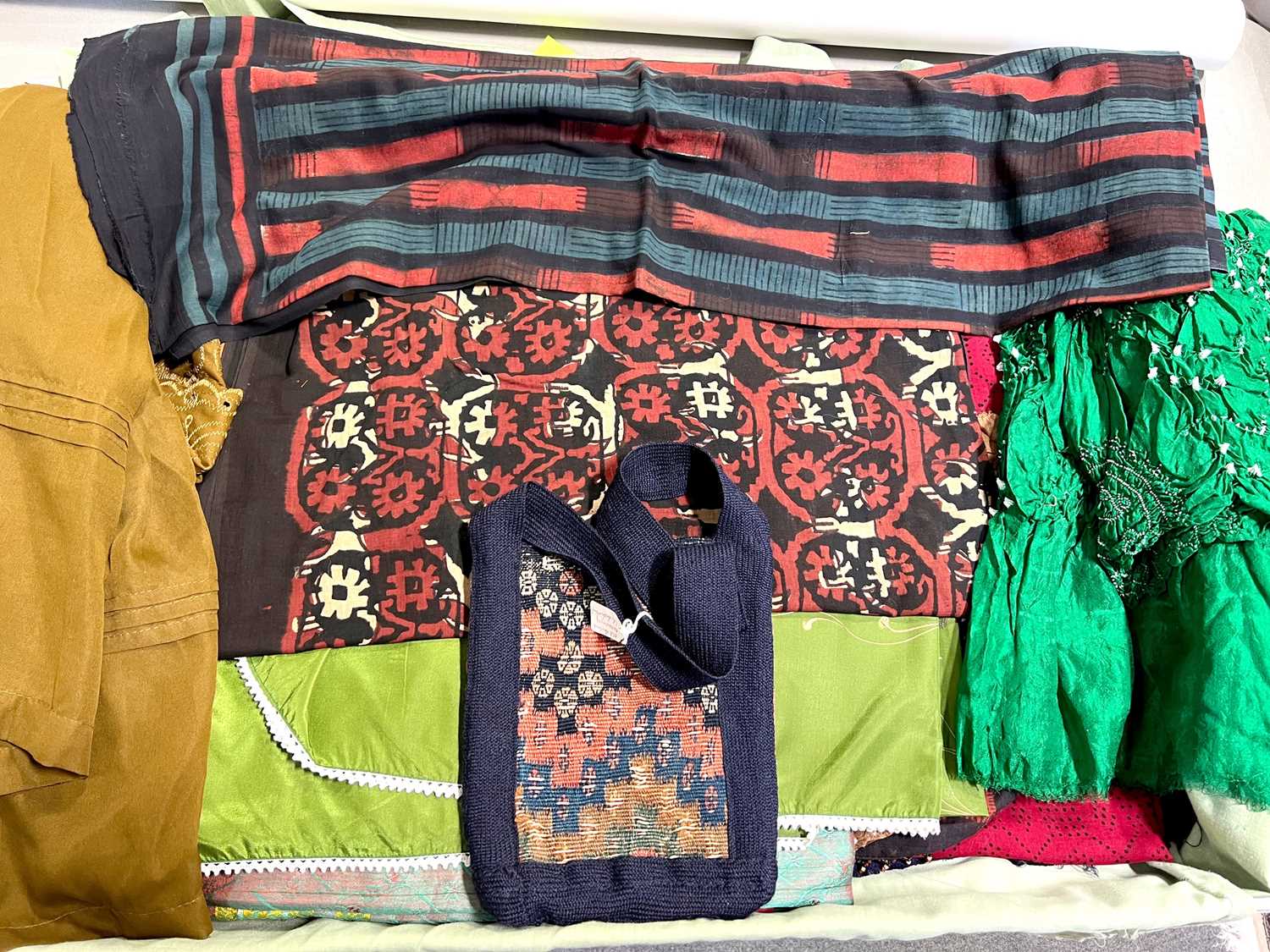 Quantity of burkhas, saris, and Bandhari fabric and clothing