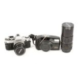 Collection of cameras, lenses and other accessories.