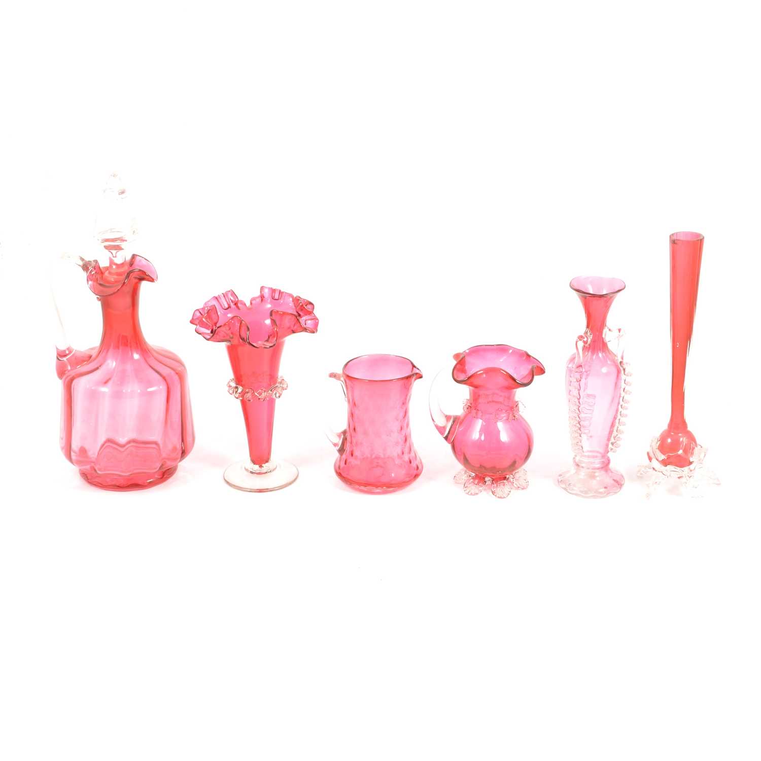 Pair of cranberry glass claret decanters, and a collection of cranberry glassware.