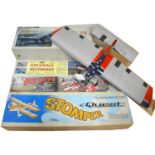 Five aero model kits, one built with FOX 35 engine
