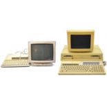 Two vintage computers, including Apricot and Olivetti PC1.