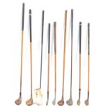 Small collection of hickory shafted golf clubs.