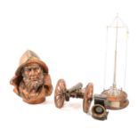 Presentation ships mast; composite bust of a sailor, scale model of a canon, and a cycle lamp.