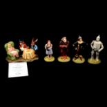Royal Doulton Wizard of Oz figurines and a Doulton-Beswick Mad Hatter's Tea Party group