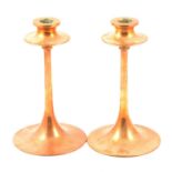 Pair of Arts & Crafts brass candlesticks, probably Dryad
