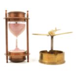 Kelvin & Hughes, Brass hourglass timer/ compass, 1917, and a brass airplane desk ornament