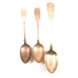 Silver basting spoon and pair of similar table spoons,