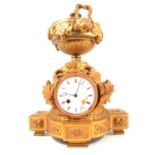 French gilt metal mantel clock, from a clock garniture, urn finial, circular enamelled dial,