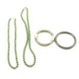 Two jade necklaces and two jade bangles.