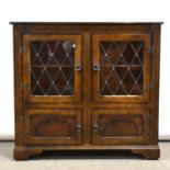 Modern oak glazed bookcase, small oak coffer and a wine table,