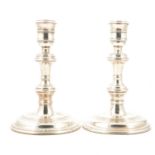 Pair of George I style silver candlesticks,