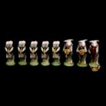 Thirteen Beswick Pig Promenade figures,