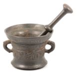 Patinated brass mortar, bears date 1667, 14cm, with a pestle.