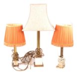 Fluted brass table lamp, on an onyx plinth; and two others.